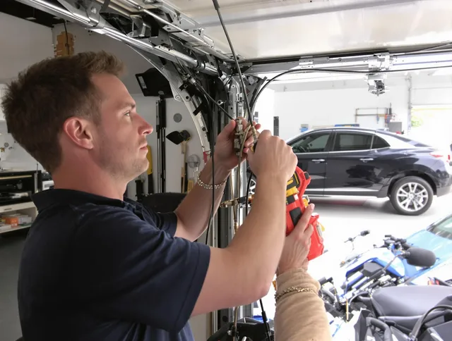 University Heights Garage Door Repair safety certified technician performing cable replacement in University Heights