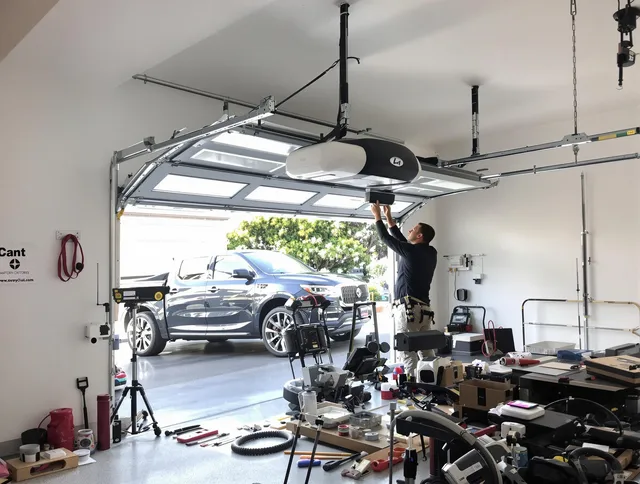 University Heights Garage Door Repair specialist installing smart garage door opener system in University Heights home