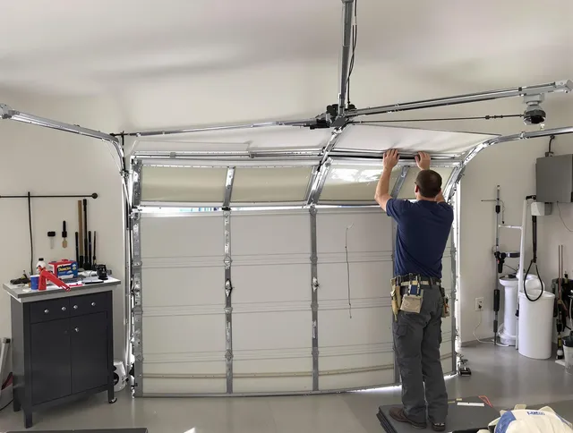 University Heights Garage Door Repair specialist performing precise section replacement on University Heights garage door