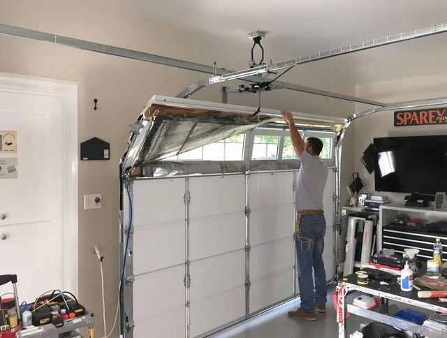 Garage door section replacement by University Heights Garage Door Repair in University Heights